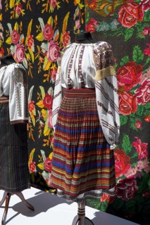 Traditional traditional costume with colorful stripes and floral embroidery, folklore festival,