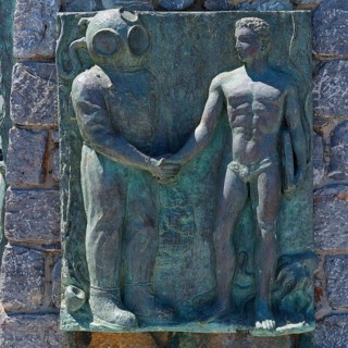 Bronze relief of a diver and a man in a handshake, Pothia, main town, port, Kalymnos, Sponge Diving