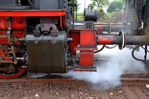 Locomotive releases steam, detailed view of the ELNA 6 four-coupler superheated steam locomotive