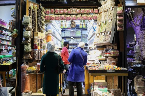 Syrians shop at the historic Al-Hamidiyah Bazaar adjacent to the Umayyad Mosque during the early