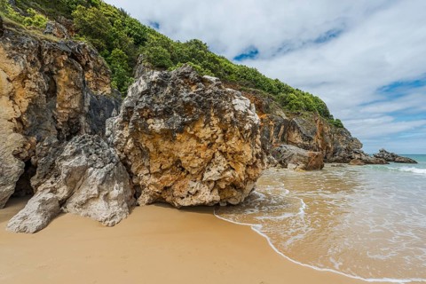 Rocks at Playa de Berria in Santona, surfing beach in Cantabria, Spain