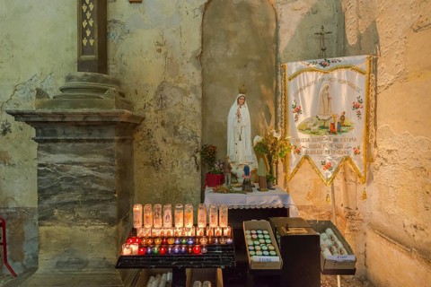 Burning commemorative candles in a church
