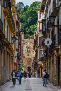 The shopping street Calle Mayor with the Basilica of Santa María del Coro in San Sebastian, Basque