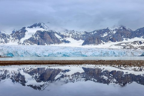 Fjortende Julibreen, 14th of July Glacier calving into Krossfjorden in spring, Haakon VII Land,