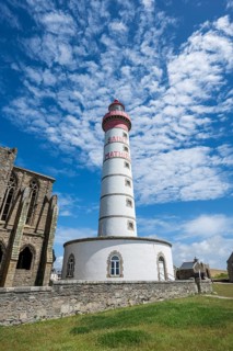 View of the 37 meter high, red-and-white striped lighthouse Phare de Saint-Mathieu, which rises