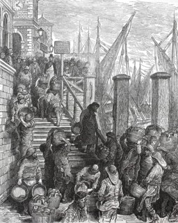 Billingsgate fish market in London. Workers and traders, porters and costermongers, unload freshly