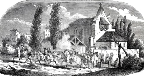 A rural, historic village scene in France in front of a church and a fortified well house, in the