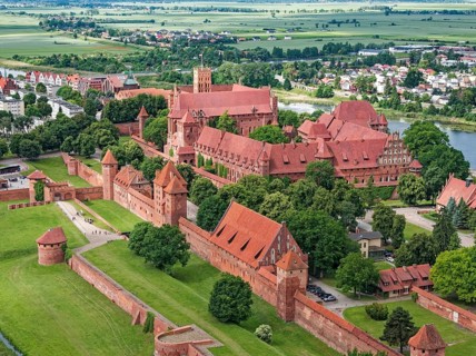Aerial view of Malbork on the Nogat. The Malborku Castle, Zamek w Malborku, is a neo-Gothic lowland