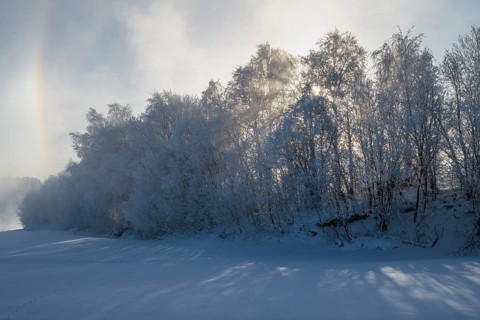 Fog and parhelion over the frozen river Glomma (Glåma), Alvdal, Hedmark, Innlandet, Norway,