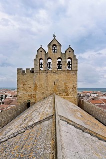 Bell tower of the Notre-Dame-de-la-Mer Roman Catholic Church, Saintes-Maries-de-la-Mer, Camargue,