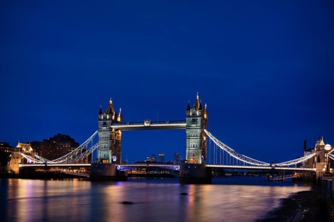 Night view, Thames, Tower Bridge, illuminated, behind Canary Wharf, blue hour, dusk, London,