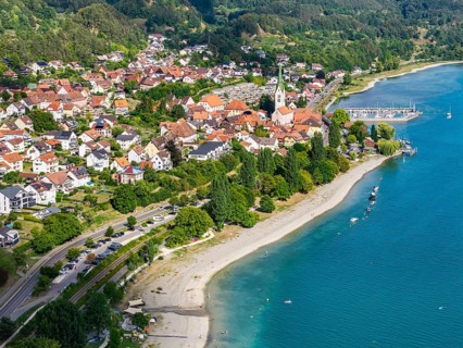 City view of Sipplingen on Lake Constance with church and marina. aerial view. Sipplingen,