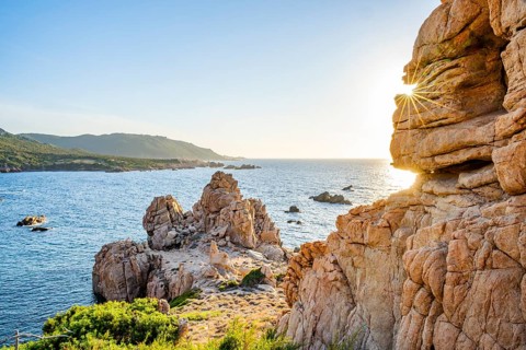 Landscape of the coastline with blue water at Costa Paradiso on a sunny day at evening, Sardinia,