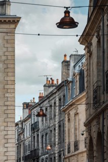 Old town alleyway with typical alleyway lights in Bordeaux, Gironde, France