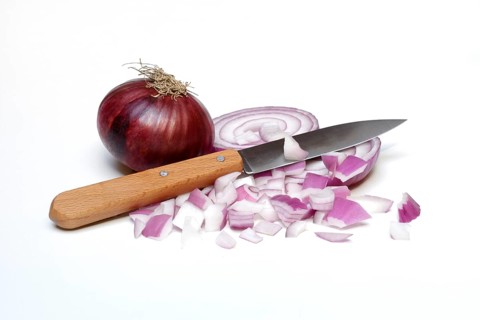 Sliced red onion with knife, Allium cepa