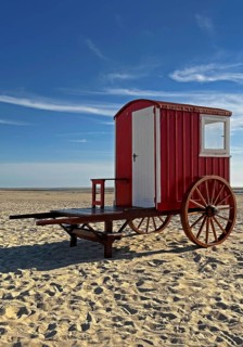 A red bathing cart on the west beach with the sea, North Sea island of Borzburg, East Frisia, Lower