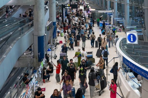Suvarnabhumi airport tourists with luggage, Bangkok, Thailand