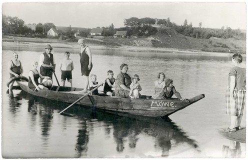 Ferry, crossing, seagull, small boat, river, woman, children, a group of people, including