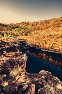 Bell Gorge waterfall, a body of water in north-west Australia in the Kimberley. Sunrise in the