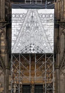 Scaffolding with black and white depiction of the restoration work on the north façade, Cologne,