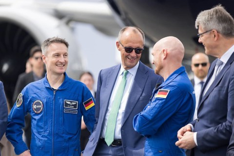 Friedrich Merz (Chancellor of the Federal Republic of Germany, CDU, wearing sunglasses) chats with