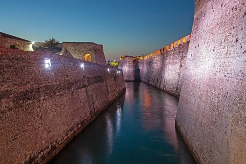 Lights illuminate the Royal moat in the Royal Walls ensemble, Ceuta, Spain, North Africa