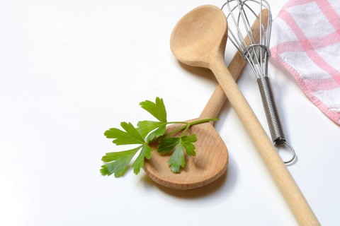 Cooking spoon and parsley, herb, Petroselinum crispum