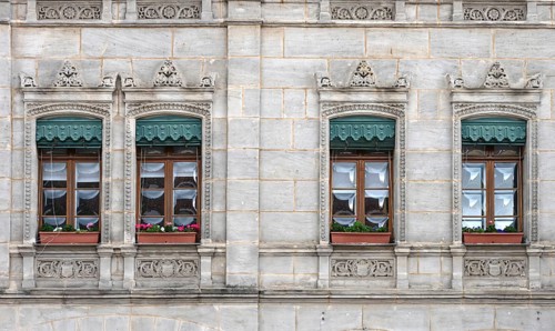 Historic windows from the 19th century, with green, decorative metal shutters, Unterer Markt 5,