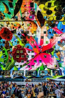 Markthal from 2014, offers over 100 food stalls and delicatessens with spectacular ceiling fresco