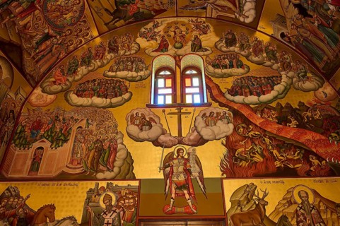 Agiou Sarvas monastery, Agion Pandon church, colorful fresco with religious scenes and a glowing