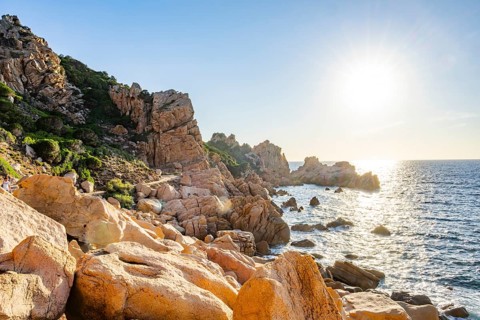 Landscape of the coastline with blue water at Costa Paradiso on a sunny day at evening, Sardinia,