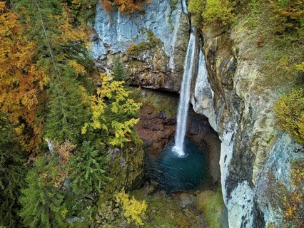 Aerial view of Berglistüber waterfall in autumn-colored surroundings, Linthal, Klausenpass, Canton