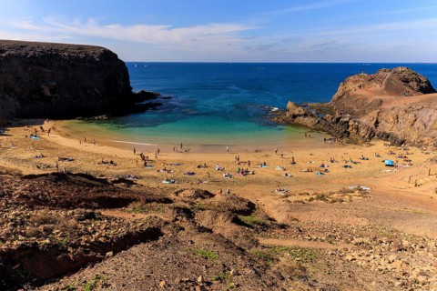 Lanzarote, Canary Islands, Spain, Europe, Playas de las Papagayo, bathers relax on a sunny beach
