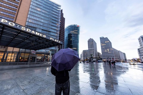Potsdamer Platz Berlin in the evening with traffic on the streets. When it rains, the skyscrapers
