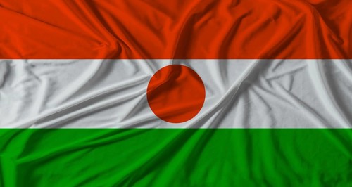Niger flag with fabric texture background. National flag of Niger with cloth texture