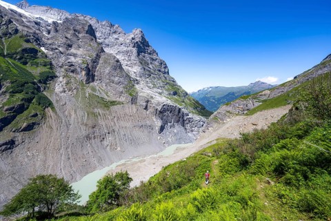 Picturesque high-alpine mountain landscape with rocky gorge, hiking to Schreckhornhütte, Bernese
