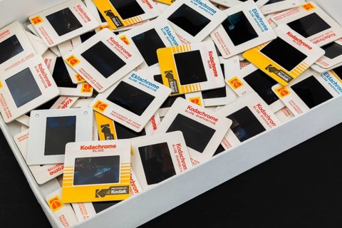 Opened storage box of old loosely arranged 1980s 35mm Kodak Kodachrome and Ektachrome slides
