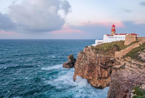 View of the Lighthouse of Cabo de Sao Vicente in Sagres, Algarve, Portugal, at sunrise with