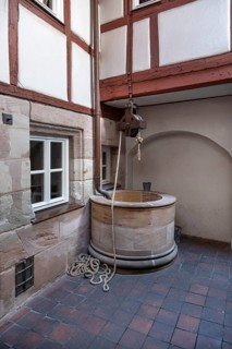 Old fountain in a historic courtyard, Obere Krämergasse 16, Nuremberg, Middle Franconia, Bavaria,