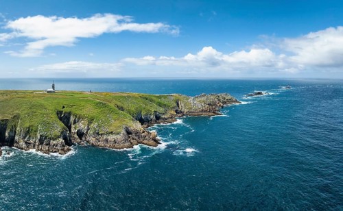 Aerial view, panorama of the Pointe du Raz headland on the stormy Breton coast with white ocean