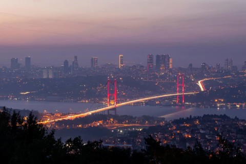 View from Camlica hill to 15 July Martyrs bridge with scyscrapers in the backgroun.d during the