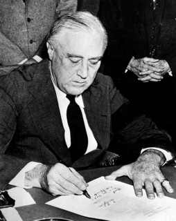 Franklin D. Roosevelt signs the declaration of war against Japan. 8 December 1941 Franklin D.