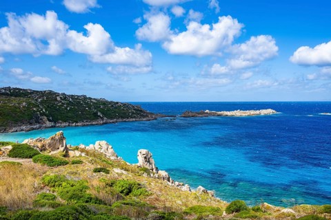 Coastline with emerald green and blue water on a sunny day at Santa Teresa di Gallura, Sardinia,