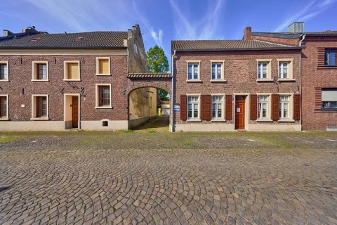 Old town, historic city center, historic brick buildings, façade with windows and shutters,