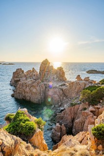 Landscape of the coastline with blue water at Costa Paradiso on a sunny day at evening, Sardinia,