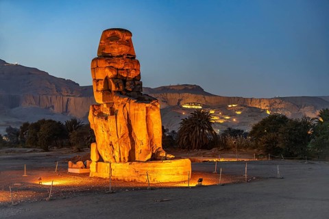 The Colossi of Memnon in the Nile Valley in West Thebes near Luxor at dusk, Egypt