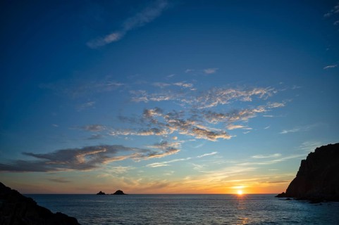 Evening, sunset at sea, The Brisons rock formation in the background, Cot Valley Beach, Porth