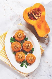 Pumpkin phali, Georgian dish, on a white plate, pumpkin appetizer with nuts and spices, no people,