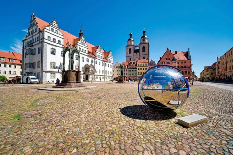 Market square with town hall, city church, town and parish church of St. Marien and globe with QR