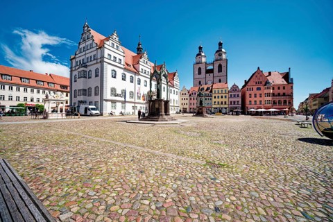 Market square with town hall, town and parish church of St. Marien, Luther monument by Johann